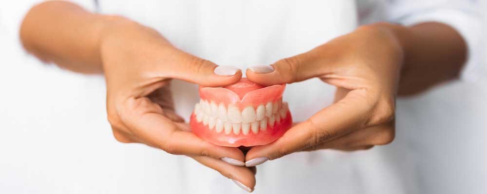 denture on hands